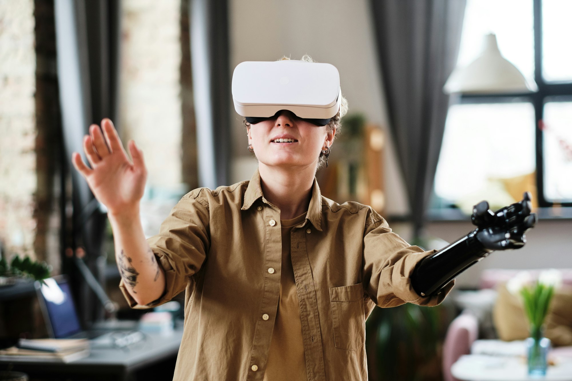 Girl with prosthesis playing virtual reality game